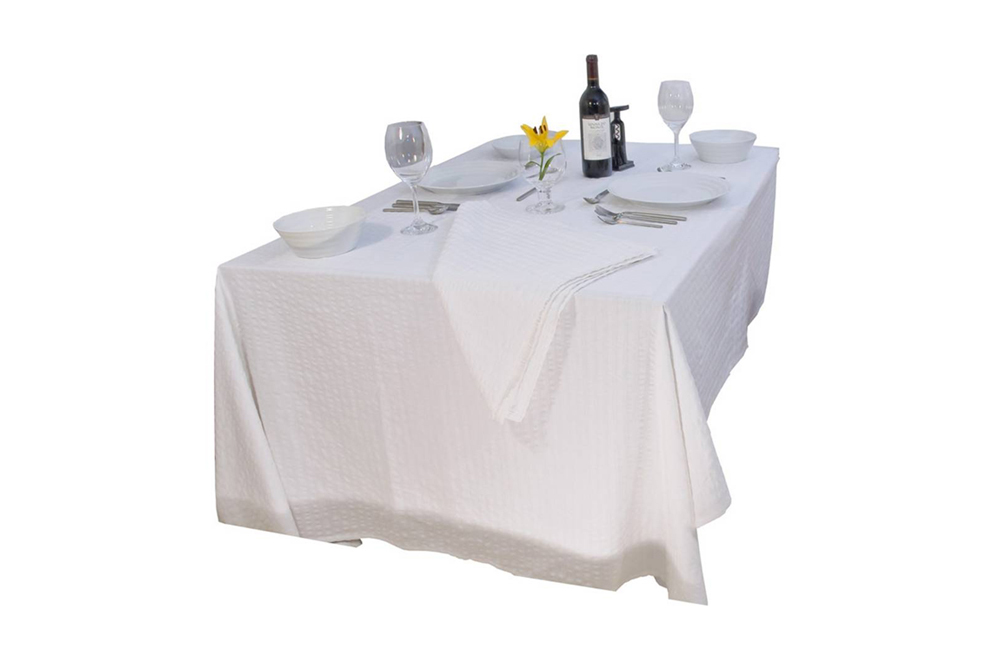 table with tablecloth and cloth napkins